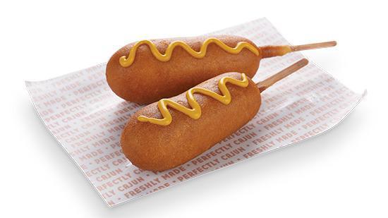 Corn Dog (1 Pc) · Made from turkey, pork, and chicken and then dunked in our secret batter, these are more than corn dogs; they’re a taste of Americana on a stick.