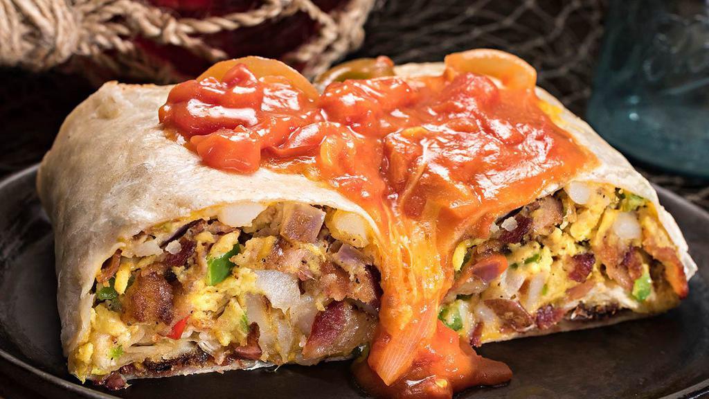 Huck's Breakfast Burrito · Your choice of grilled ham, sausage, bacon OR Andouille sausage tossed with bell pepers, onions, scrambled eggs, cheddar cheese and Country Reds rolled inside a warm tortilla topped with Creole sauce OR Huck's chili.