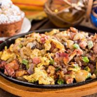 The Mississippi · Ham, crisp bacon, sausage, bell peppers, onions, and mushrooms topped with Monterey Jack che...