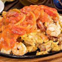 New Orleans · Andouille sausage, Louisiana shrimp and mushrooms topped with melted Monterey jack cheese an...