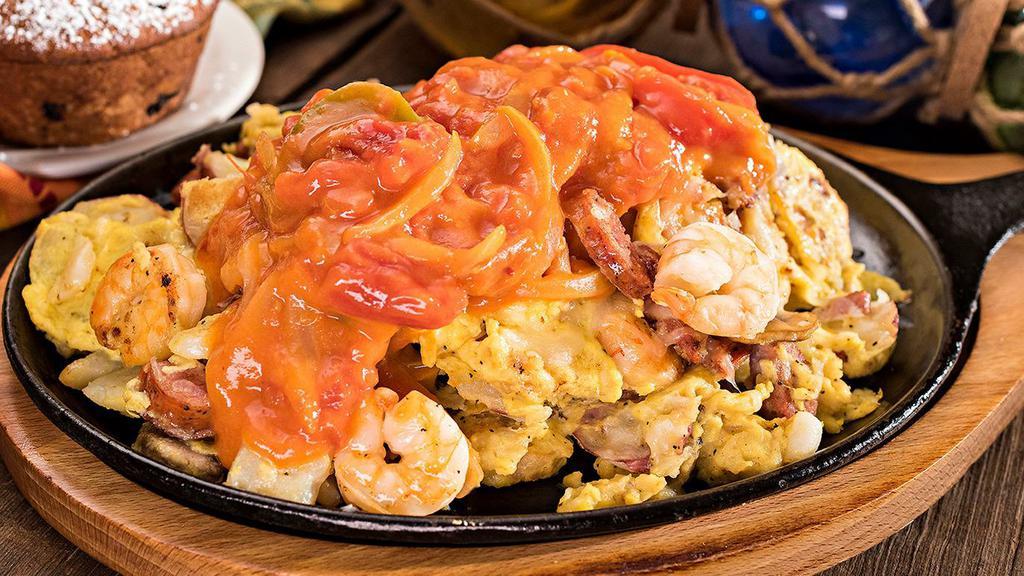New Orleans · Andouille sausage, Louisiana shrimp and mushrooms topped with melted Monterey jack cheese and creole sauce.