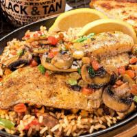 Louisiana Catfish · Prepared one of two styles then served over Jambalaya rice with garlic bread and choice of s...