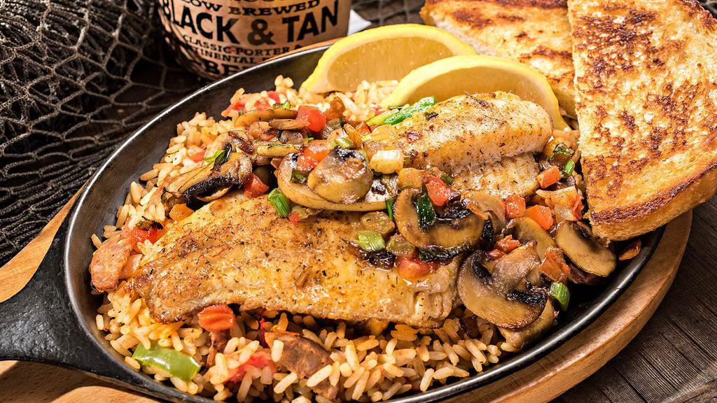 Louisiana Catfish · Prepared one of two styles then served over Jambalaya rice with garlic bread and choice of scratch-made soup or salad. 11.99.