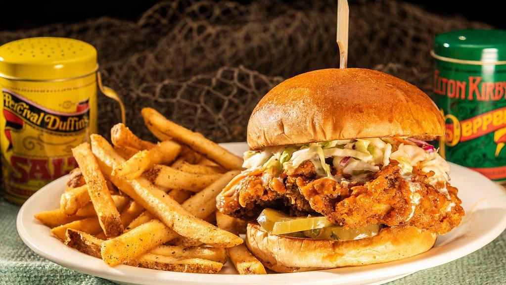 Spicy Bayou Chicken · A hand-breaded breast, fried crisp & tossed in Frank's Hot Sauce stacked high with crisp slaw and pickle chips.