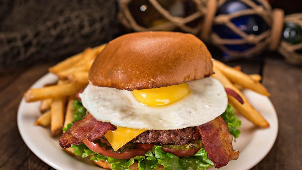 Bubba'S · A big, two-fisted burger loaded with all the good stuff- smokey bacon, aged cheddar cheese and a sunny-side up egg.