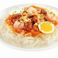 Palabok Fiesta · A traditional Filipino noodle dish covered in garlic sauce, sauteed pork, shrimp, and egg. N...