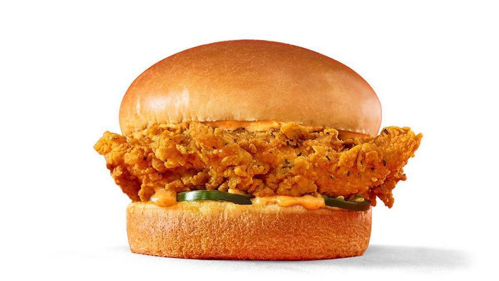 Spicy Chicken Sandwhich · Our Spicy Chicken Sandwhich starts with a crispy juicy hand-breaded chicken breast fillet, spread with sriracha mayo and served with fresh jalapenos on a toasted brioche bun