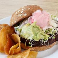 Veggie Burger · Vegetarian, Home-made Grain Patty on a Sesame Bun. Served with Lettuce, Tomato, Pickle, Red ...