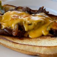 Papa Philly Cheese-Steak · Thin-Sliced Steak with Sautéed Bell Peppers and Onions. Served on a Soft Roll Topped with Wa...