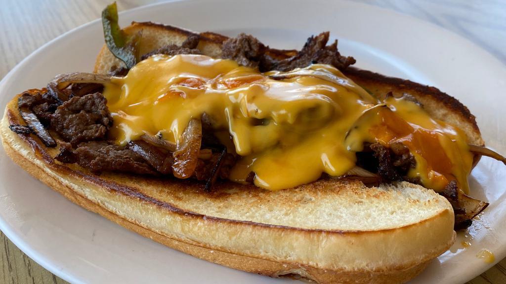 Papa Philly Cheese-Steak · Thin-Sliced Steak with Sautéed Bell Peppers and Onions. Served on a Soft Roll Topped with Warm Cheese Sauce.
