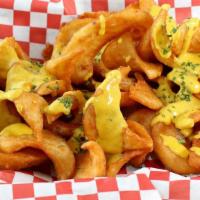 Curry Fries · Side Winder Potato Fries Served with Warm Curry Beer Cheese Sauce.