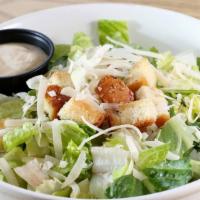 Caesar Salad · Romaine Lettuce, Shredded Parmesan, House Baked Croutons. Served with Creamy Caesar Dressing.