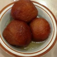 81. Gulab Jamun · Fried Indian milk balls in rosewater and sugar syrup.