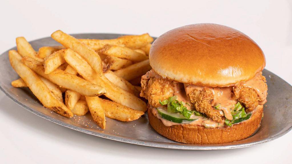 Regular Seasoned Tender Sandwich · 3 hand-breaded crispy chicken tenders served on buttery brioche bun with housemade pickles and shredded lettuce. Served with a side of seasoned fries.