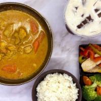 Curry Chicken Rice 咖哩雞飯 · Boneless chicken stewed with mild yellow curry sauce topped on the rice and served with stea...