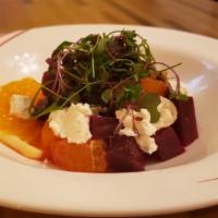 Beets Salad · Roasted beets, citrus, goat cheese, shaved onions, hazelnuts.