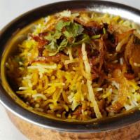 Dum Chicken Biryani · Basmati rice, onion, mint, saffron, cooked 'dum'style.