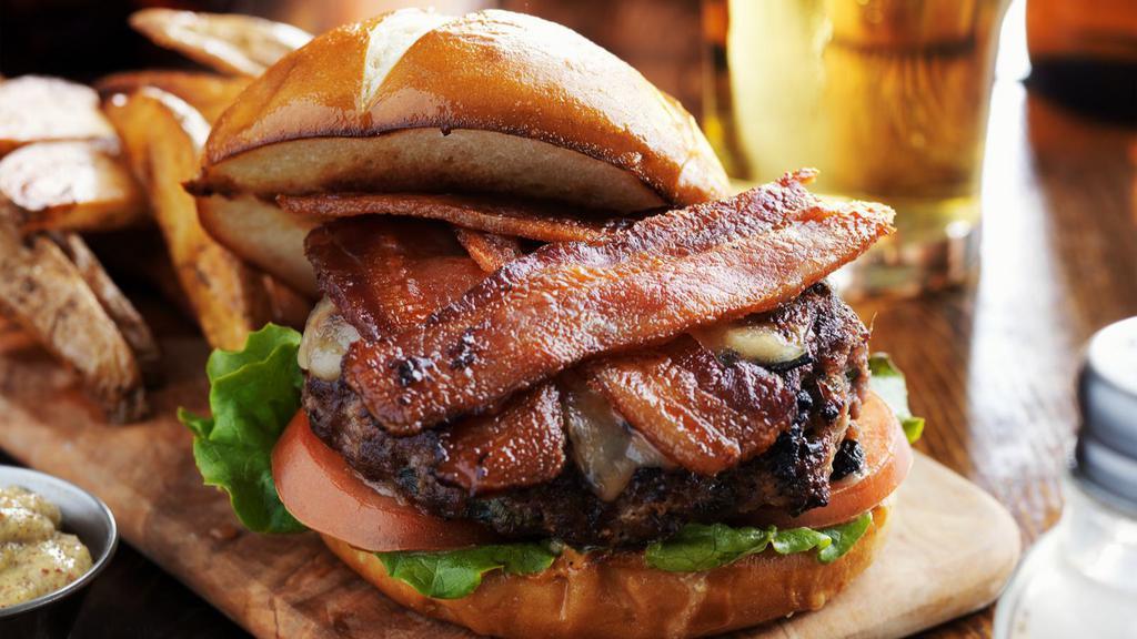 Bacon Cheeseburger · Mouthwatering burger topped with melted cheese, bacon, lettuce, pickles, onions, tomatoes, and mayo.