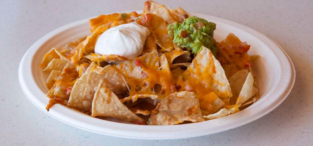 Nachos · 1460-1600 calories. Tortilla chips covered with Jack and Cheddar cheeses, beans, salsa, roja sauce, guacamole and sour cream.