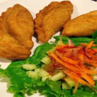 Curry Puffs · Homemade Thai samosa stuffed with yellow curry taro, potatoes, corn, and onion. Served with ...