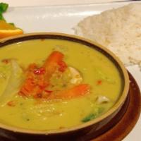 Green Curry · Green coconut curry with basil, kaffir leaves, bell peppers, bamboo shoots, snow peas, and c...