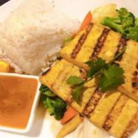 BBQ Tofu (Organic) · Thai style grilled marinated tofu with peanut sauce. Served with sautéed mixed veggies.