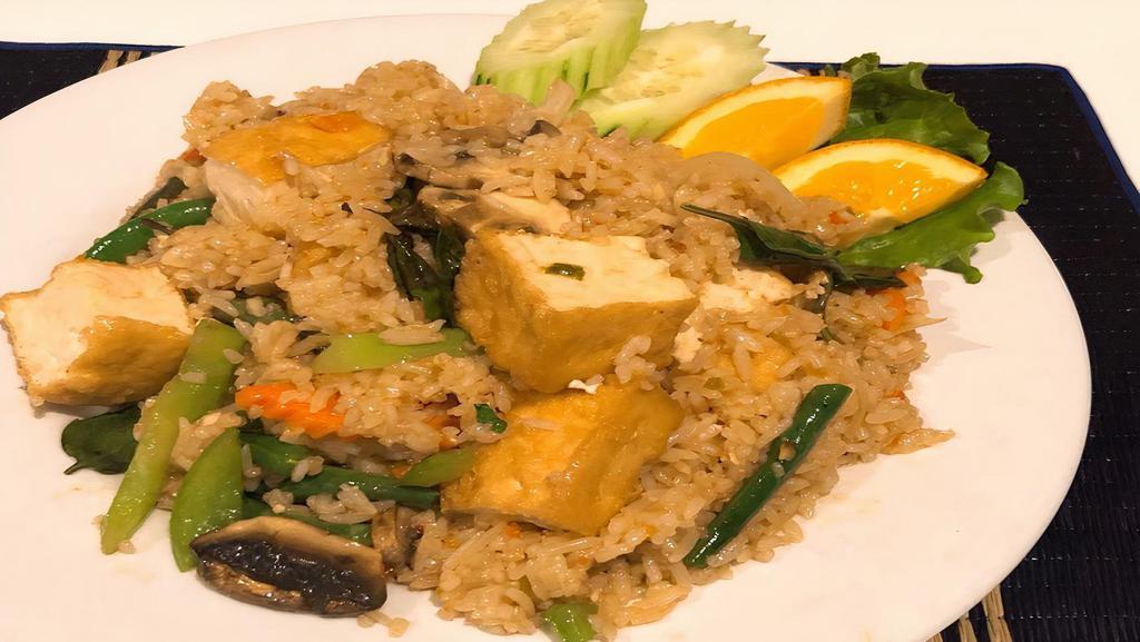 Fried Rice Basil · Stir-fried jasmine rice with basil, garlic, mushrooms, carrots, bell peppers, onions, jalapenos, Thai chili, baby corn.