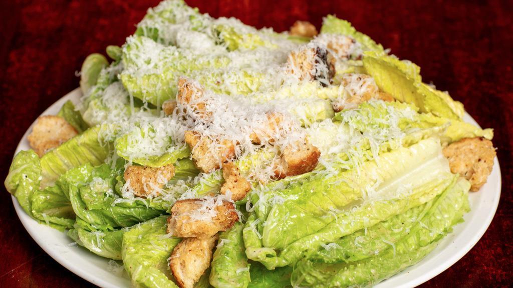 Classic Caesar Salad · Hearts of Romaine, Torn Garlic Croutons, Bruce's Caesar Dressing, Grana Padano