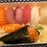 Nigiri Combination · Seven pieces of nigiri sushi and one handroll.
