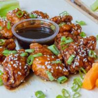 Famous Bone-Less Teriyaki Wings · Served with carrot & celery.