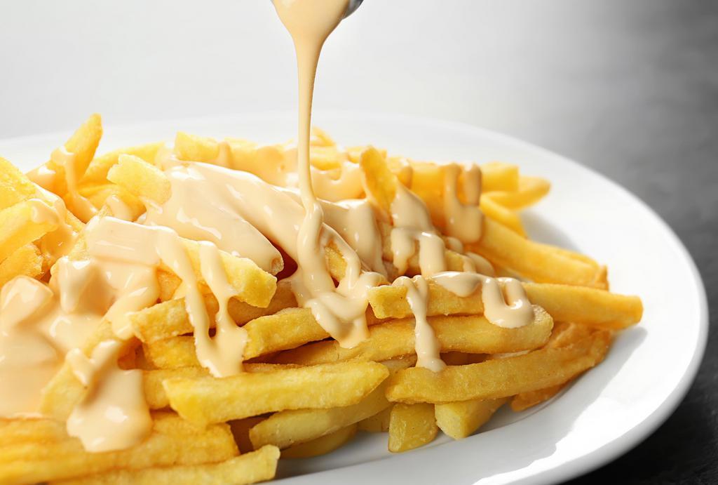 Cheese Fries · Our homemade crispy fries drizzled with yummy cheese sauce.