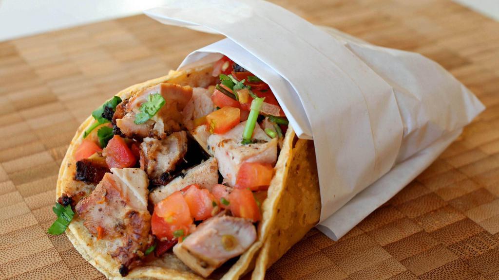 Grilled Chicken (T) · 4 inch corn tortilla with grilled chicken and pico de gallo. Crispy taco is fried with the cheese on top. Soft taco comes with beans.