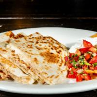 Quesadilla Rodeo · Grilled tortillas with melted jack cheese choice of shredded chicken or grilled steak, inclu...