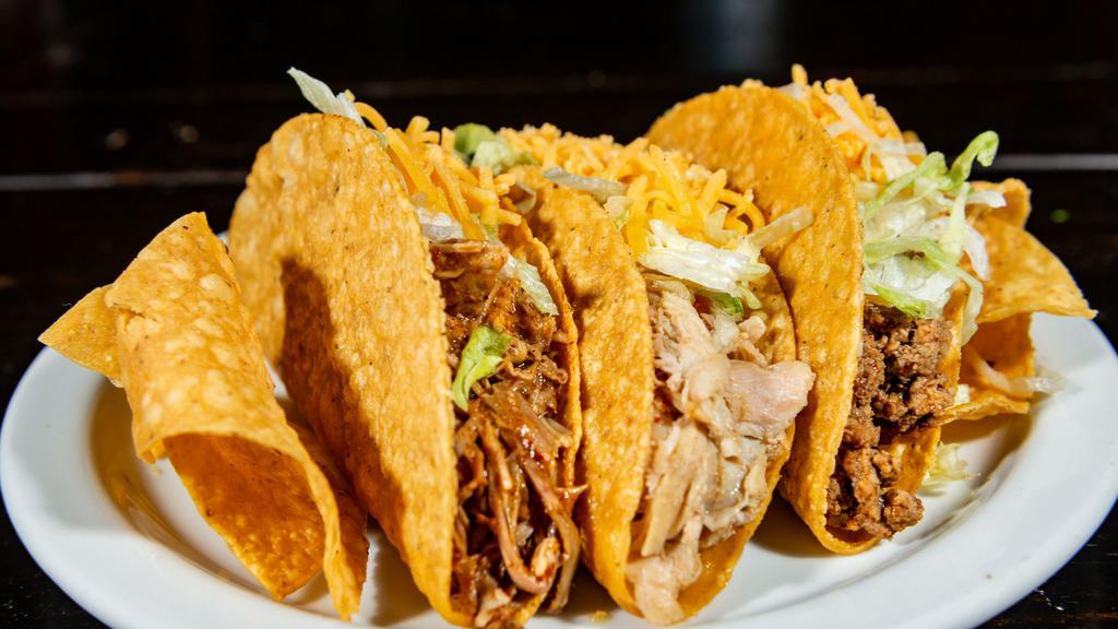 Crispy Taco · Hard shell filled with lettuce and cheese.