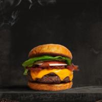 Bussin' Bacon Burger · Seasoned Beyond meat patty topped with melted vegan cheese, layers of crispy vegan bacon, le...
