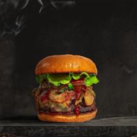 Smoked Cookout Burger · Seasoned Beyond meat patty topped with melted vegan cheese, barbecue sauce, lettuce, tomato,...