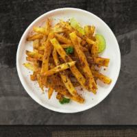 Spicy Dicy Fries · Idaho potato fries cooked until golden brown and garnished with chipotle spice.