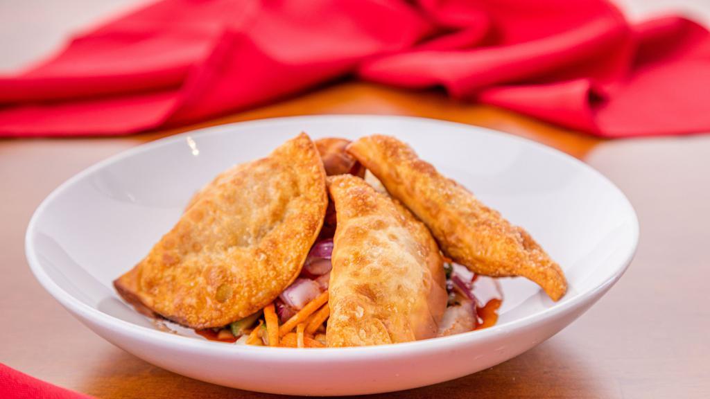 V. Thai Samosa (5 pcs.) · Crispy wrap with mixed with potato, onion and
curry powder served with cucumber salad.