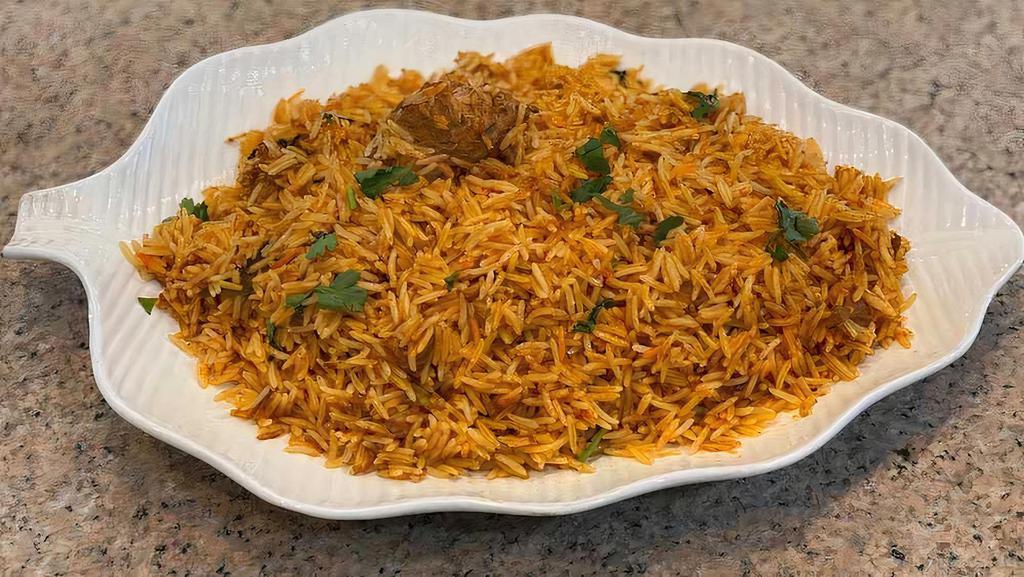 Goat Biryani · Goat cooked with basmati rice and spices