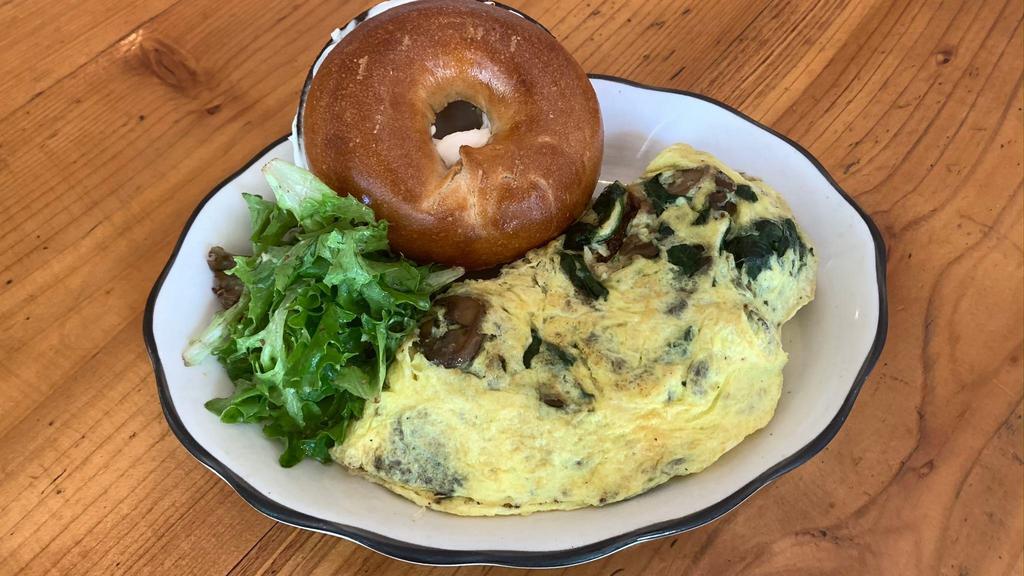 Mushroom Omelette * · eggs, caramelized onions, spinach & swiss cheese