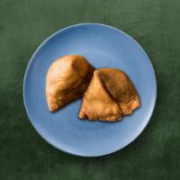 Veggie Samosa(2 pcs) · Triangular pastry with a savory filling of spiced potatoes, peas, and lentils.