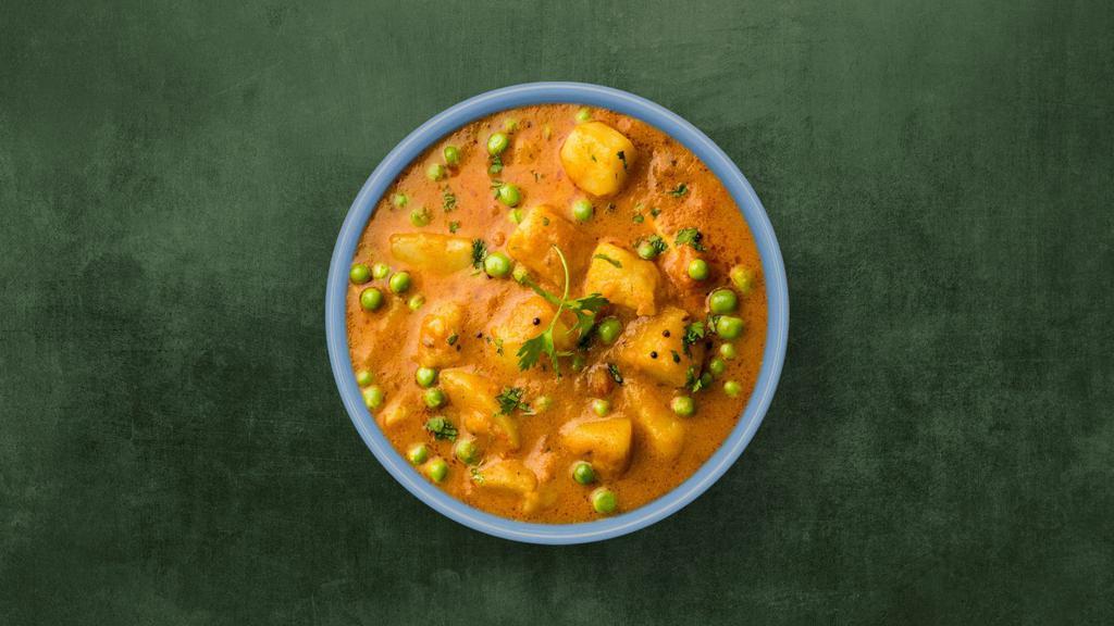 Perfect Potato Peas · Delicious Indian dish with potatoes and peas slowly cooked in Indian herbs and spices in a spiced tomato sauce. Served with a side of plain rice.
