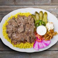 Beef Shawarma Plate · Tender beef, hummus, green salad, rice, and warm pita bread.