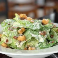 Caesar Salad · Locally grown lettuce topped with fresh shaved parmesan cheese and herb croutons.