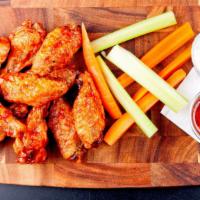 Hot Wings (6 Pc) · Fresh chicken wings marinated in a pepper seasoning and served with choice of dipping sauce.