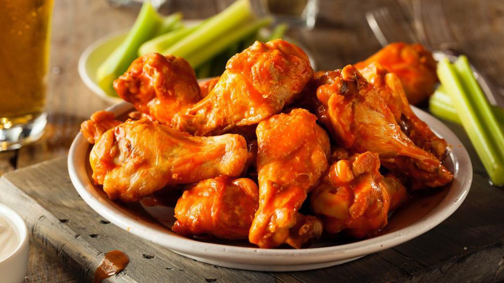 Hot Wings (12 Pc) · Fresh chicken wings marinated in a pepper seasoning and served with choice of dipping sauce.