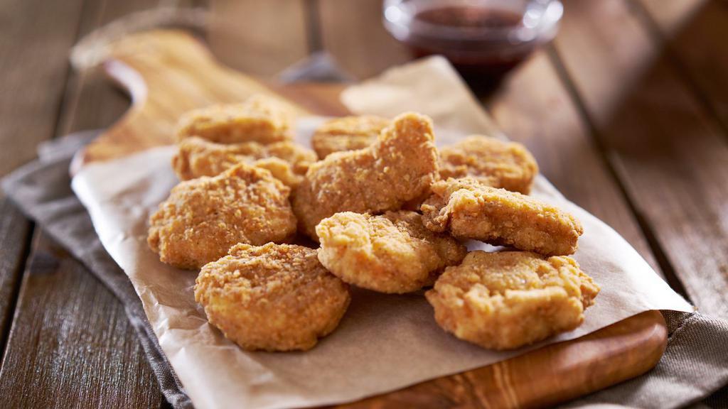 Chicken Nuggets · Eight PCs crispy golden chicken nuggets and french fries served with choice of dipping sauce.
