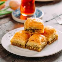 Pistachio Baklava · Two PCs traditional filo pastry with layers of chopped pistachio and sweet syrup.