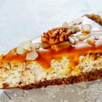 Caramel Fudge New York Cheesecake · Fresh baked cheesecake with a creamy caramel fudge filling and buttery crust.