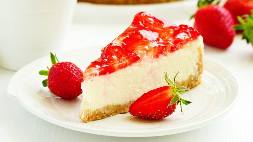Strawberry New York Cheesecake · Fresh baked cheesecake with a creamy strawberry filling and buttery crust.